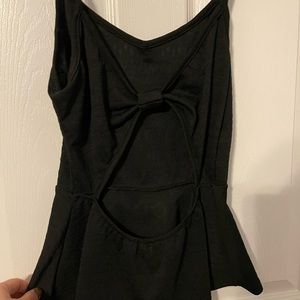 Peplum tank with open back